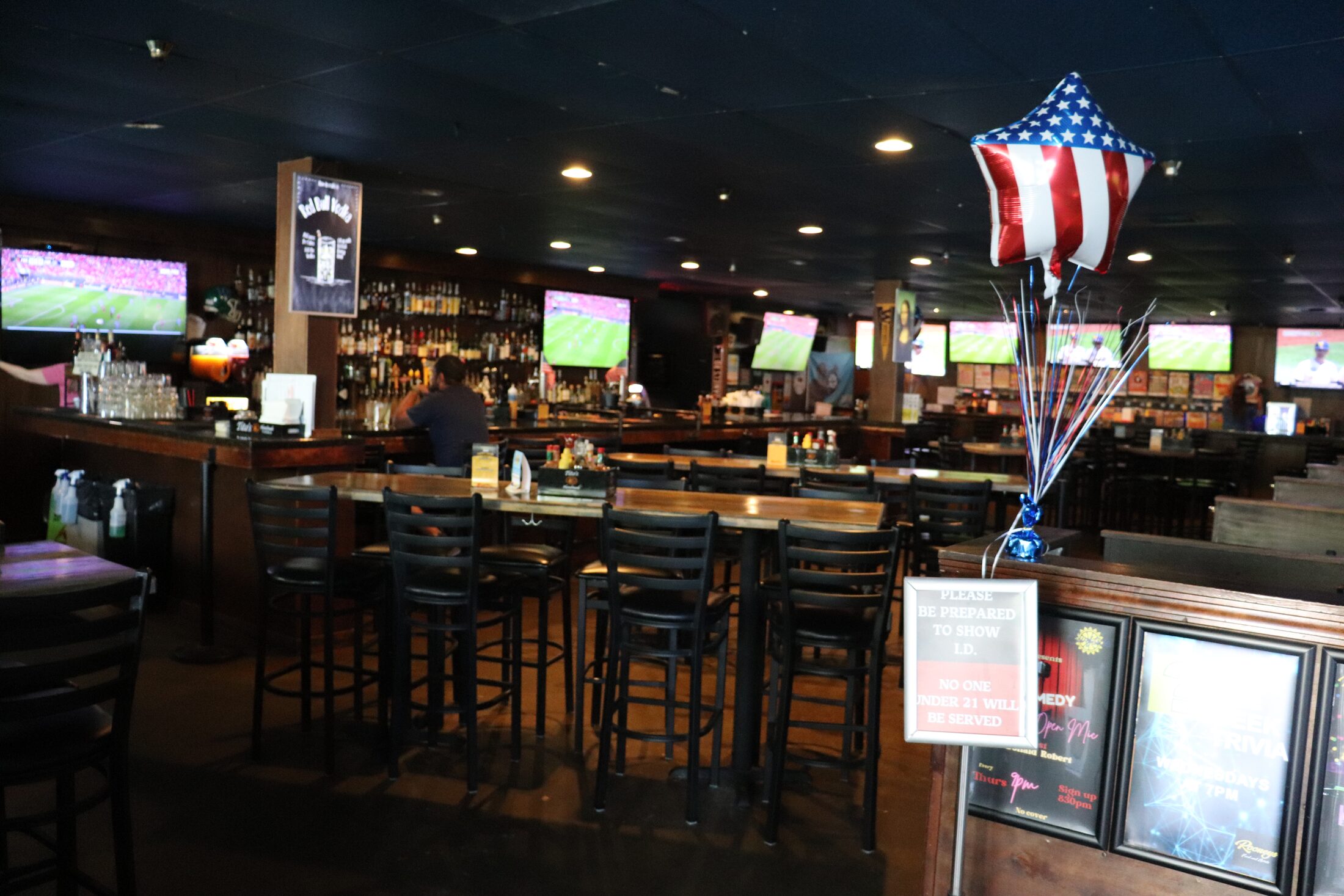 Bar seating and TVs along Rooneys back bar