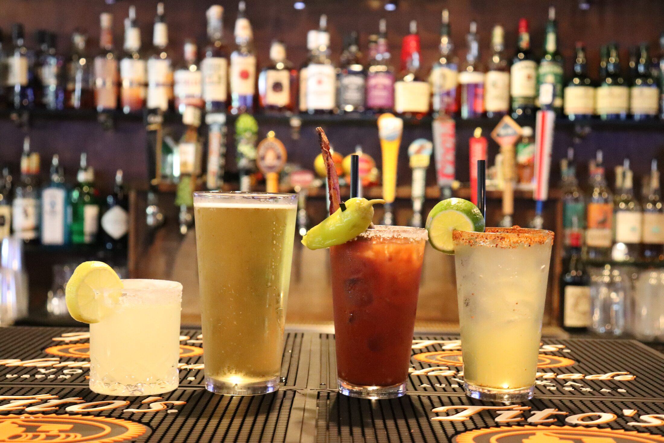 A lineup of draft beer, cocktails and Bloody Marys on the bar at Rooneys