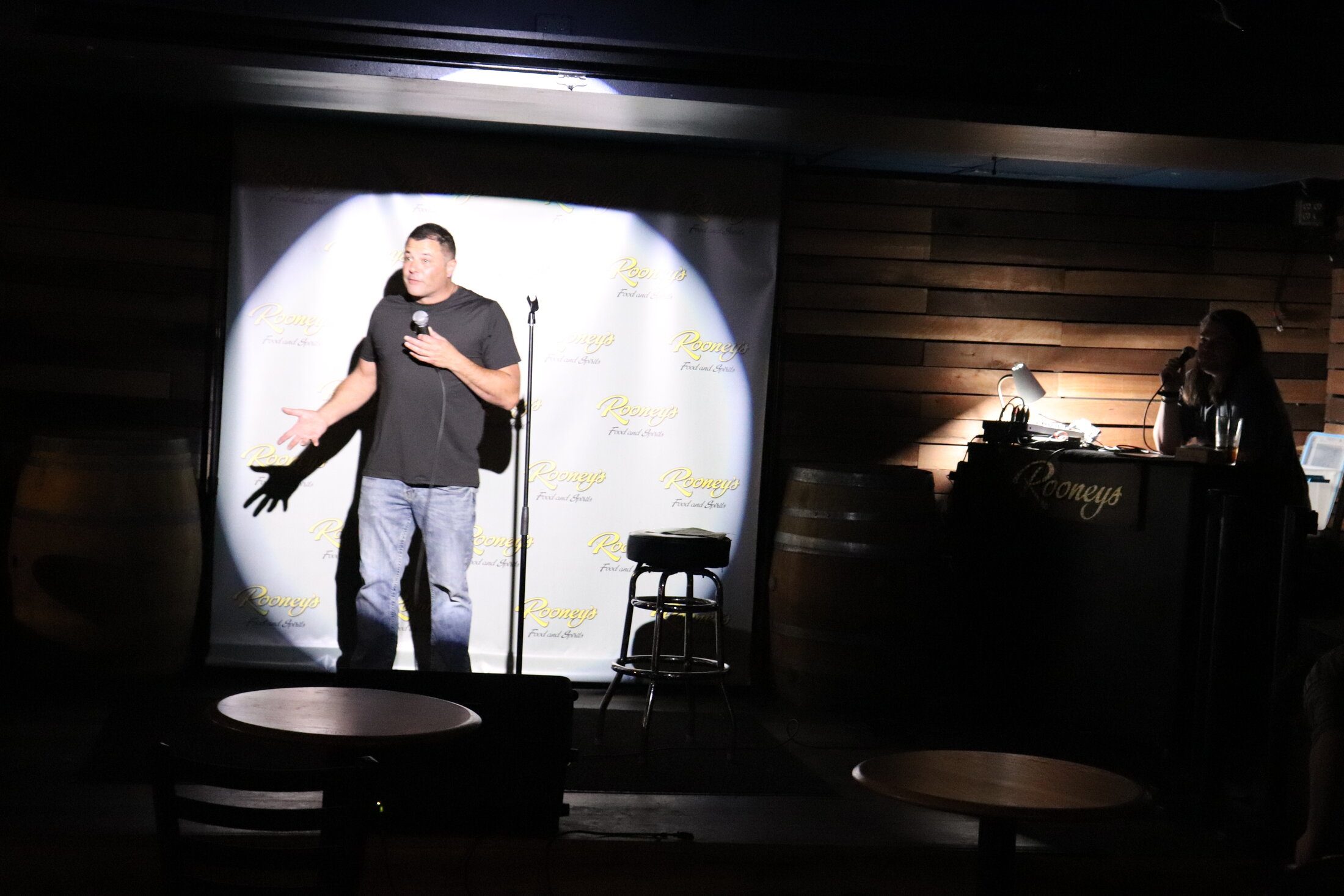 A comedian on the mic during Open Mic Comedy at Rooneys in Woodinville