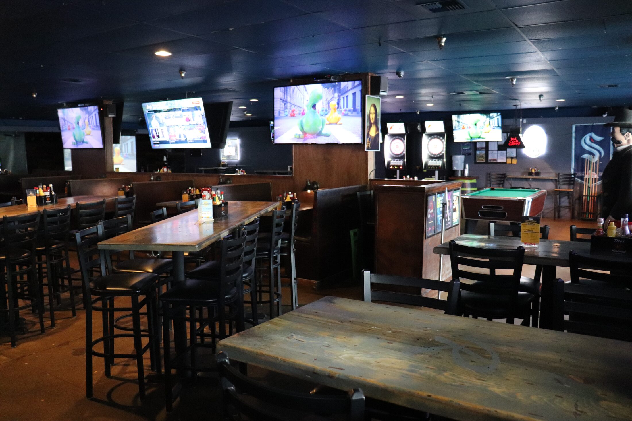 Rooneys dining area with TVs and dart boards