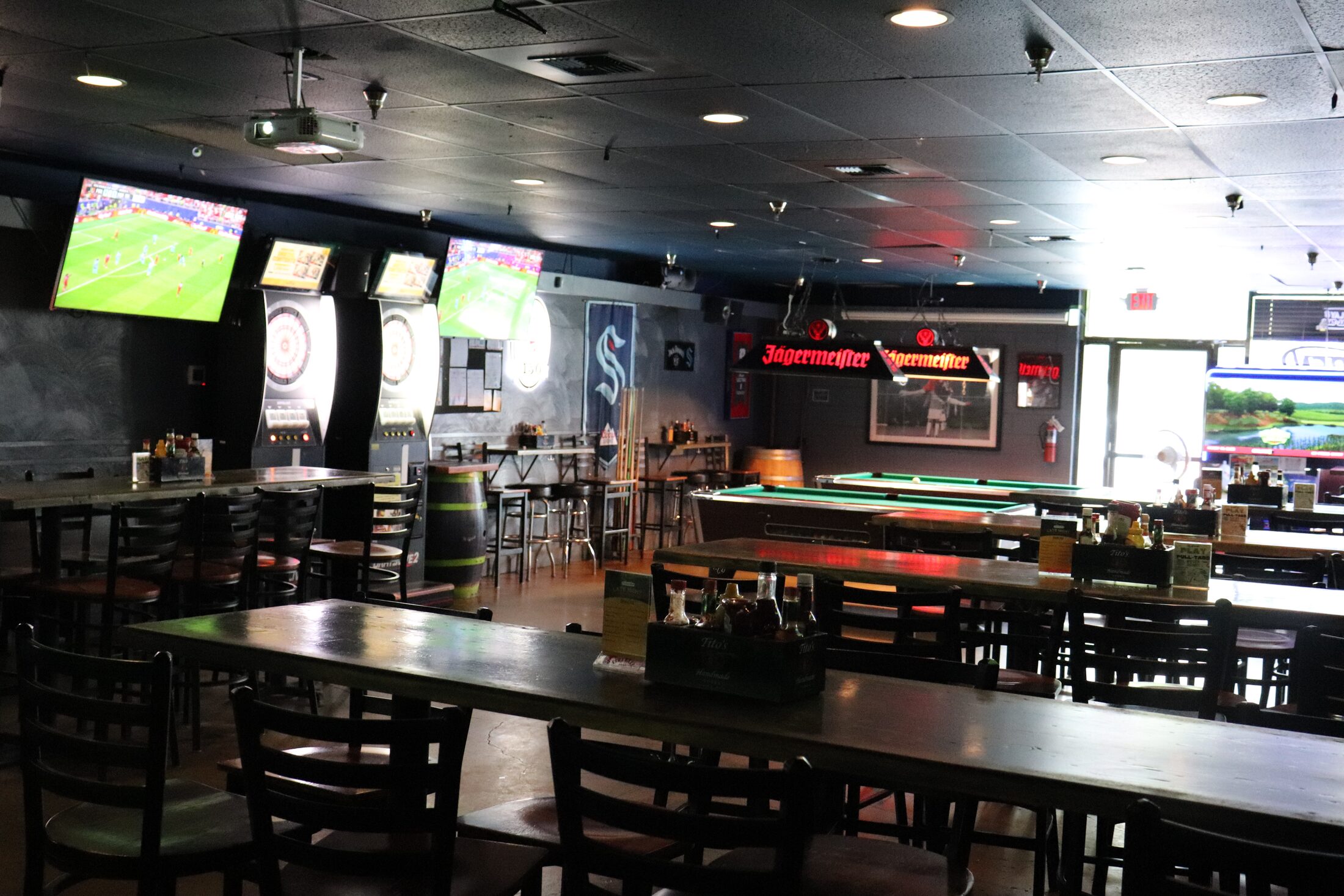 Rooneys game room with pool tables and dart boards
