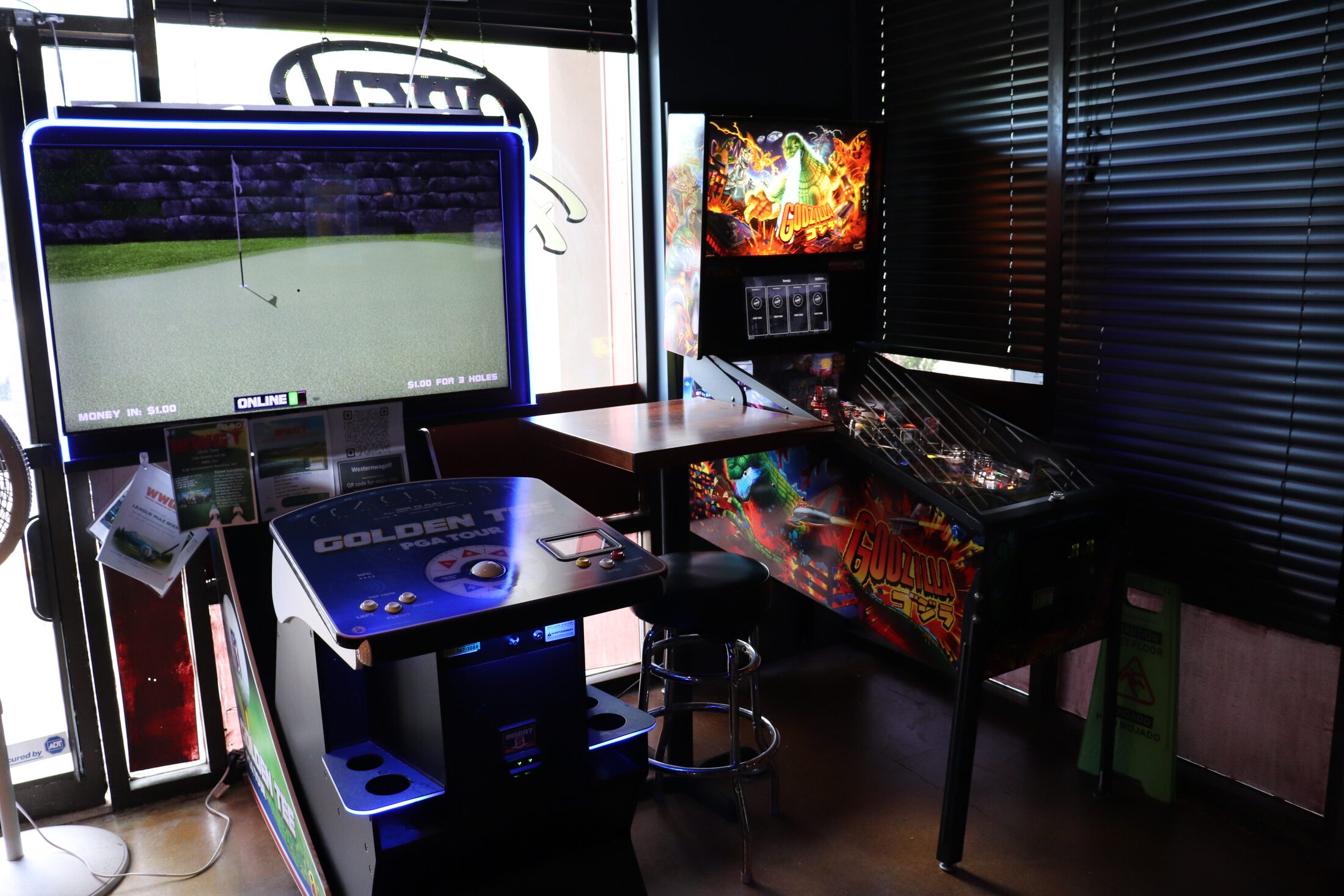Golden Tee golf arcade and Godzilla pinball machine at Rooneys in Woodinville