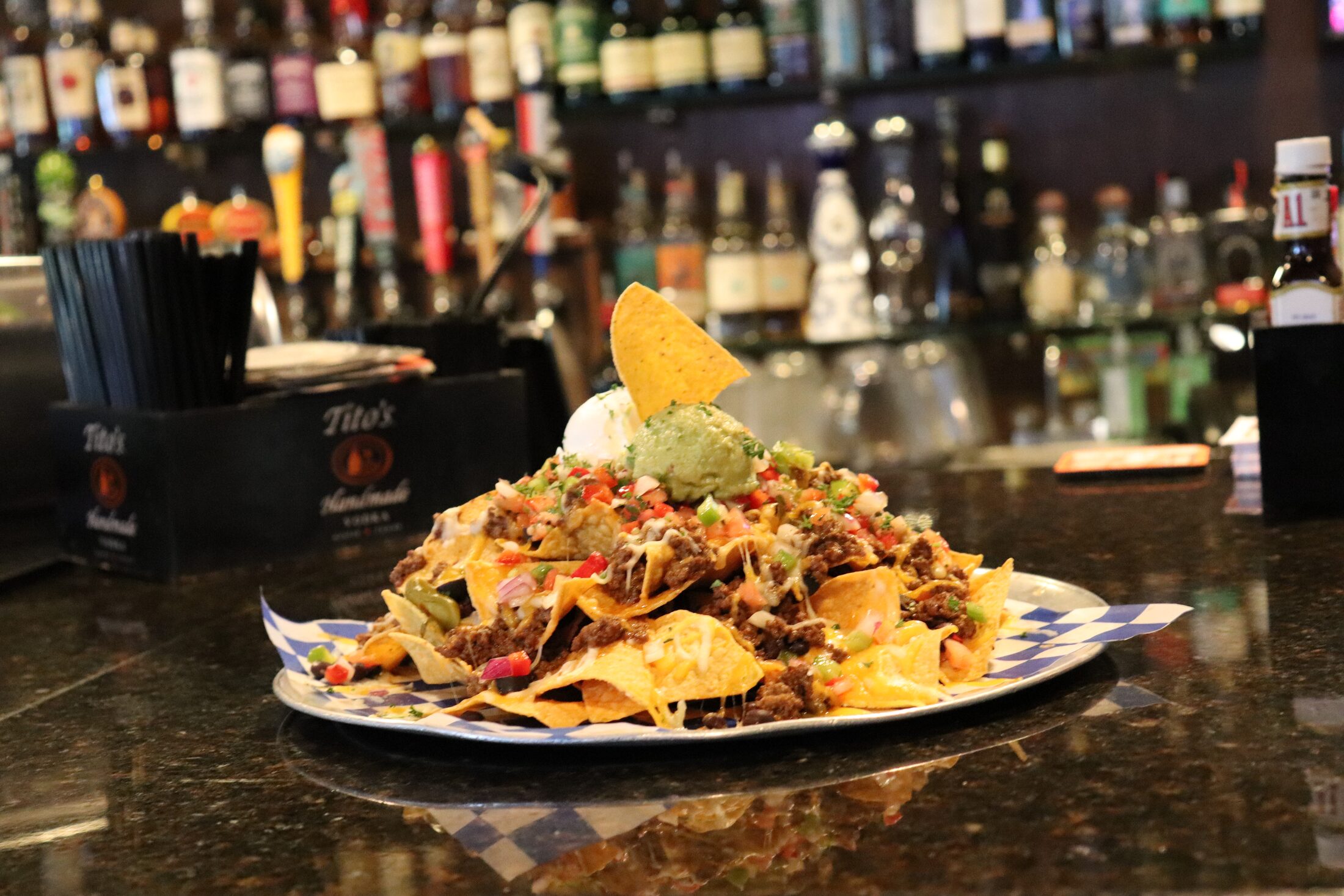 Rooneys loaded nachos piled with seasoned beef, melted cheese, pico de gallo and guacamole