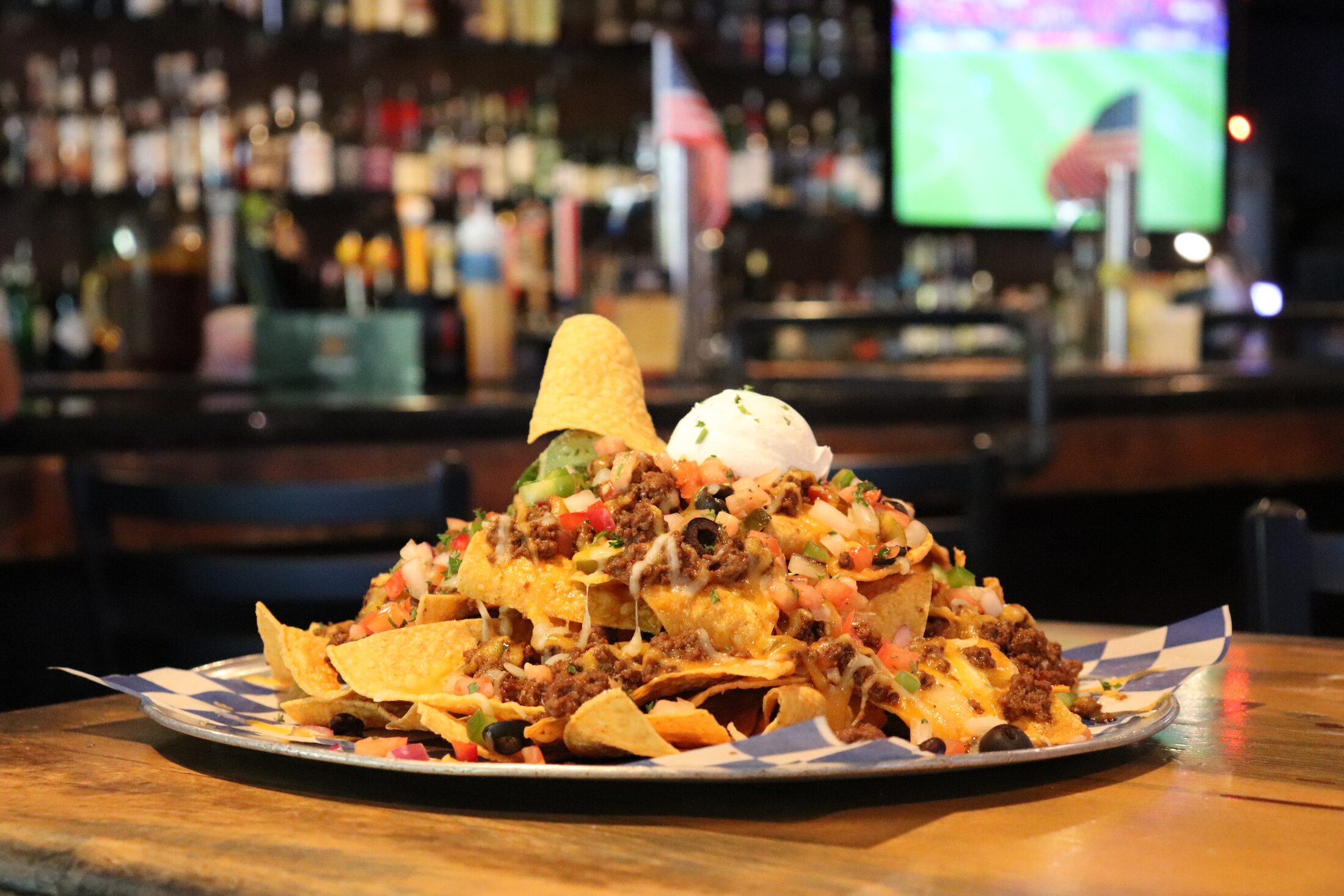 Rooneys loaded nachos piled high on the bar in Woodinville
