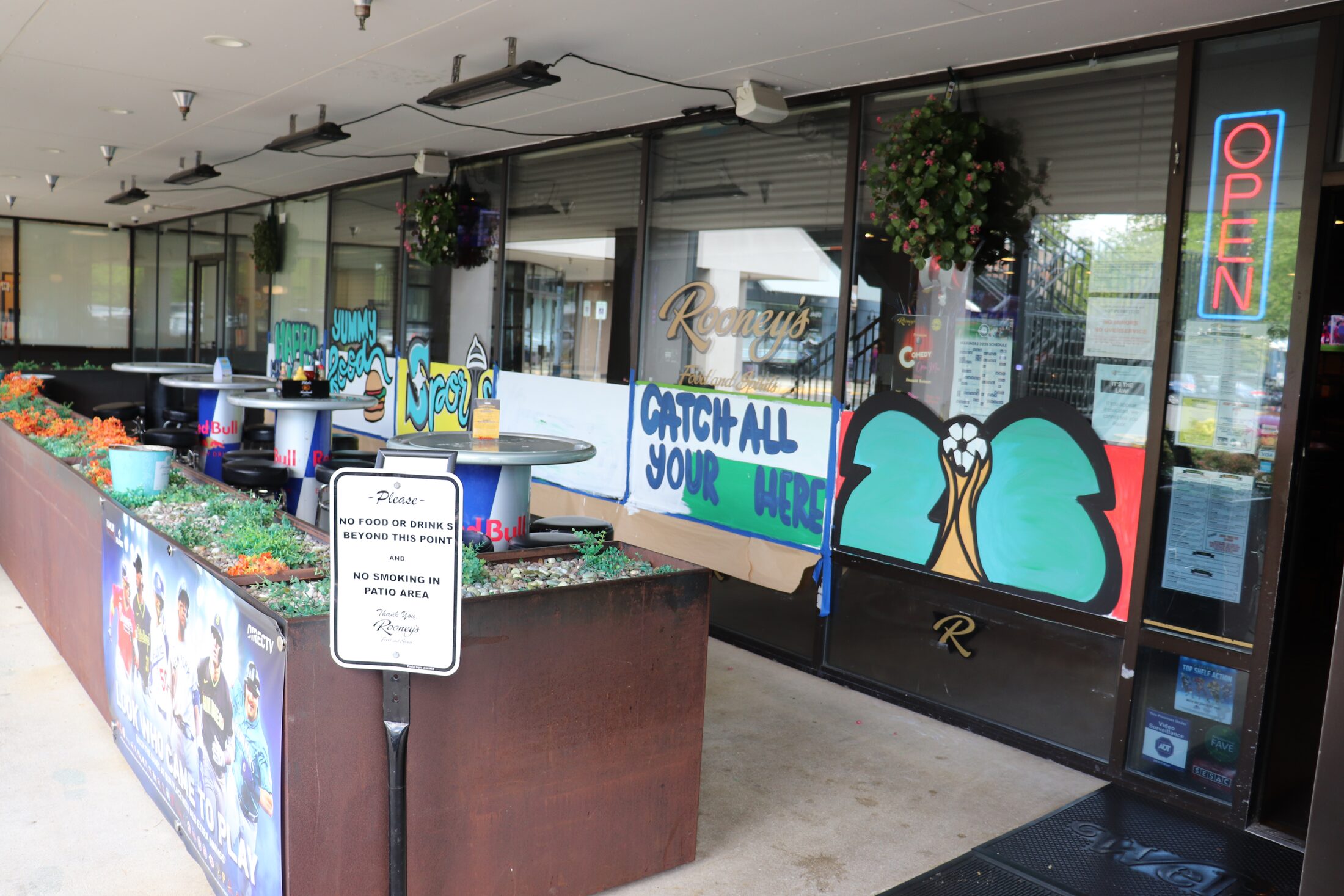 Rooneys patio entrance and World Cup mural in Woodinville Towne Center