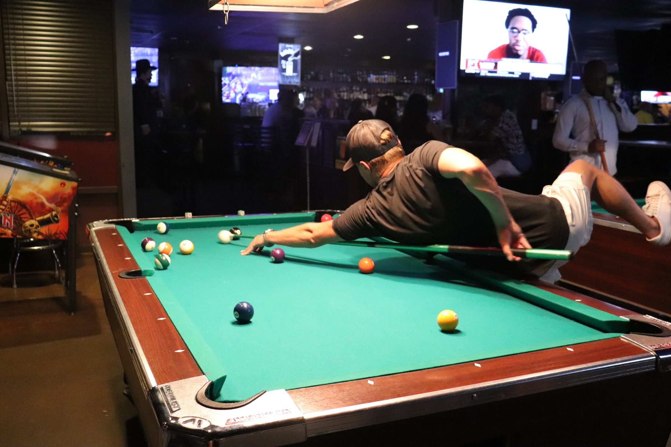 Players around the pool tables at Rooneys Sports Bar in Woodinville