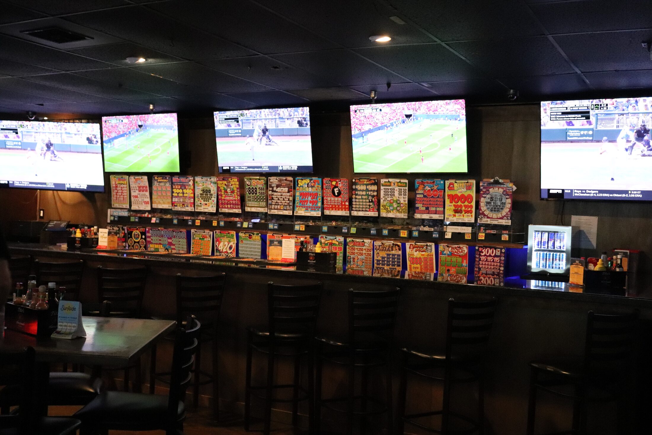 Pull tab bowls along the bar with TVs at Rooneys sports bar